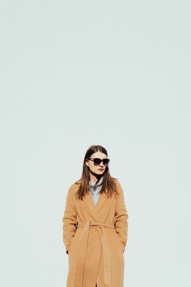Two each of gray, white, and black shirts arranged on table.