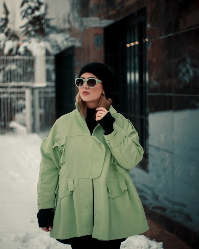 Two each of gray, white, and black shirts arranged on table.