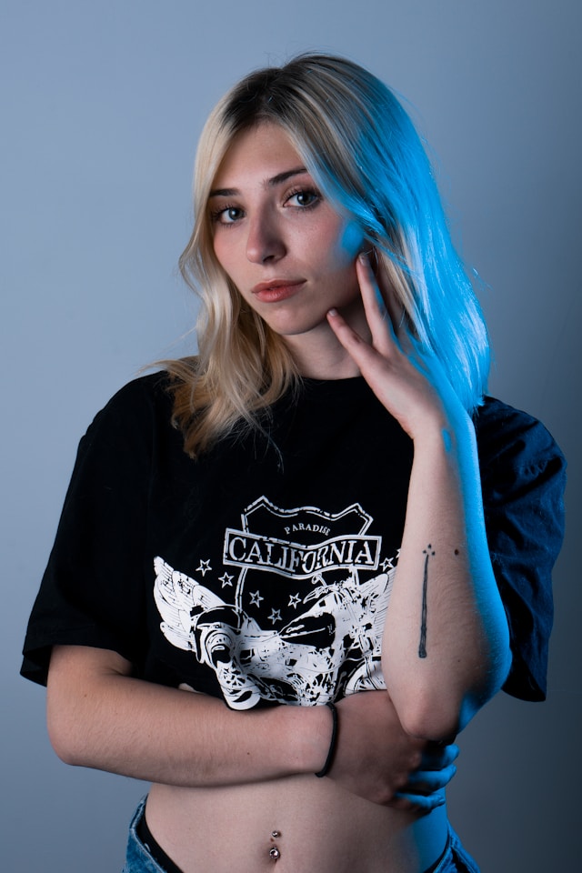 Two each of gray, white, and black shirts arranged on table.